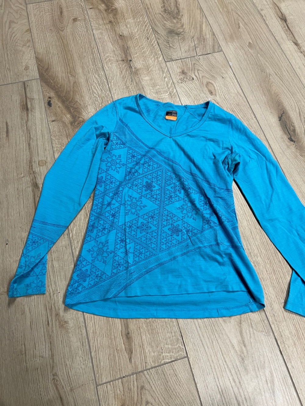 Icebreaker Women's Long Sleeve V-Neck Top in Teal with Dark Teal Geometric Print